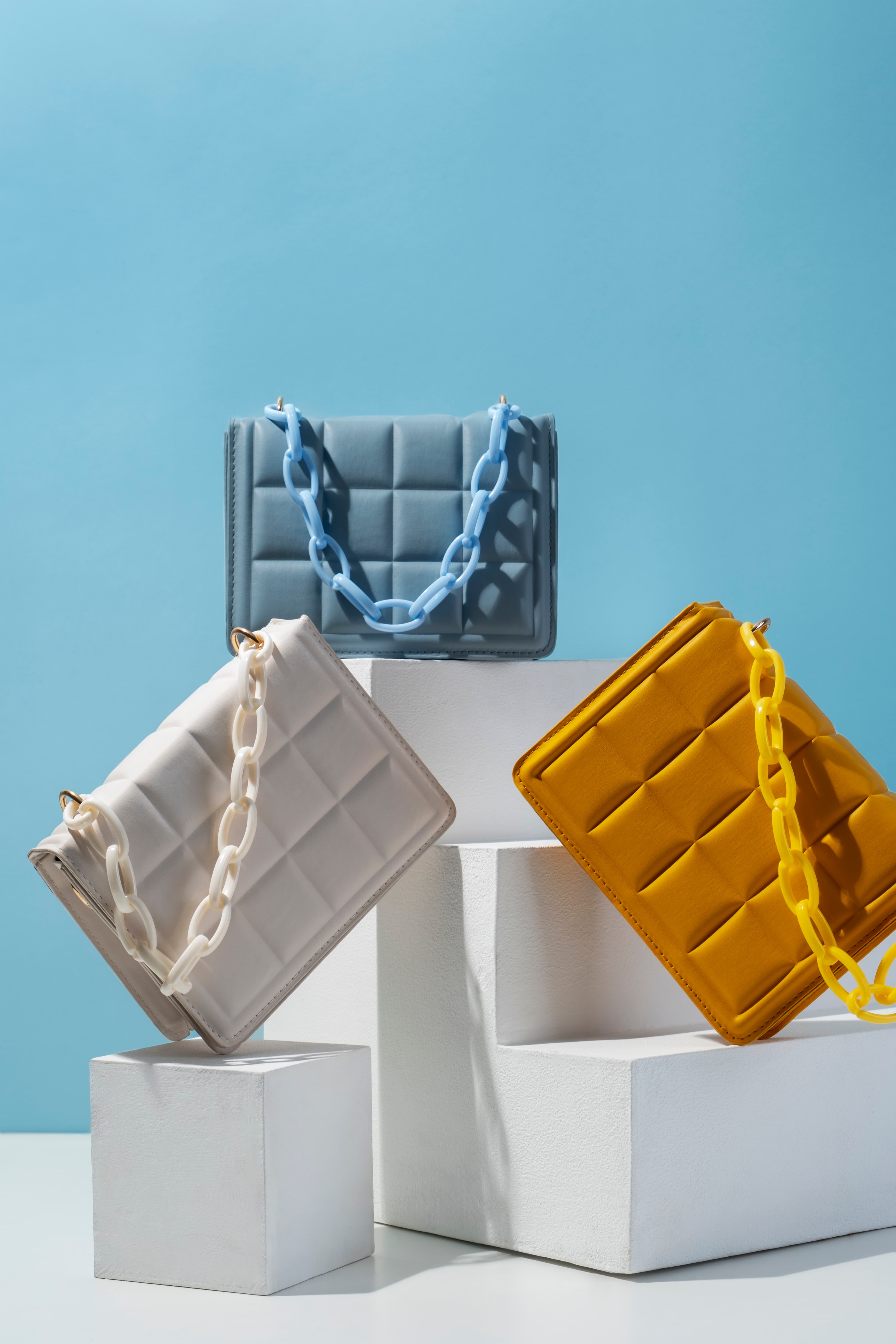 ÉLAN quilted bags collection — blue, white, mustard